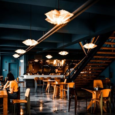 Elegant modern café with warm lighting and contemporary decor, creating a cozy atmosphere.